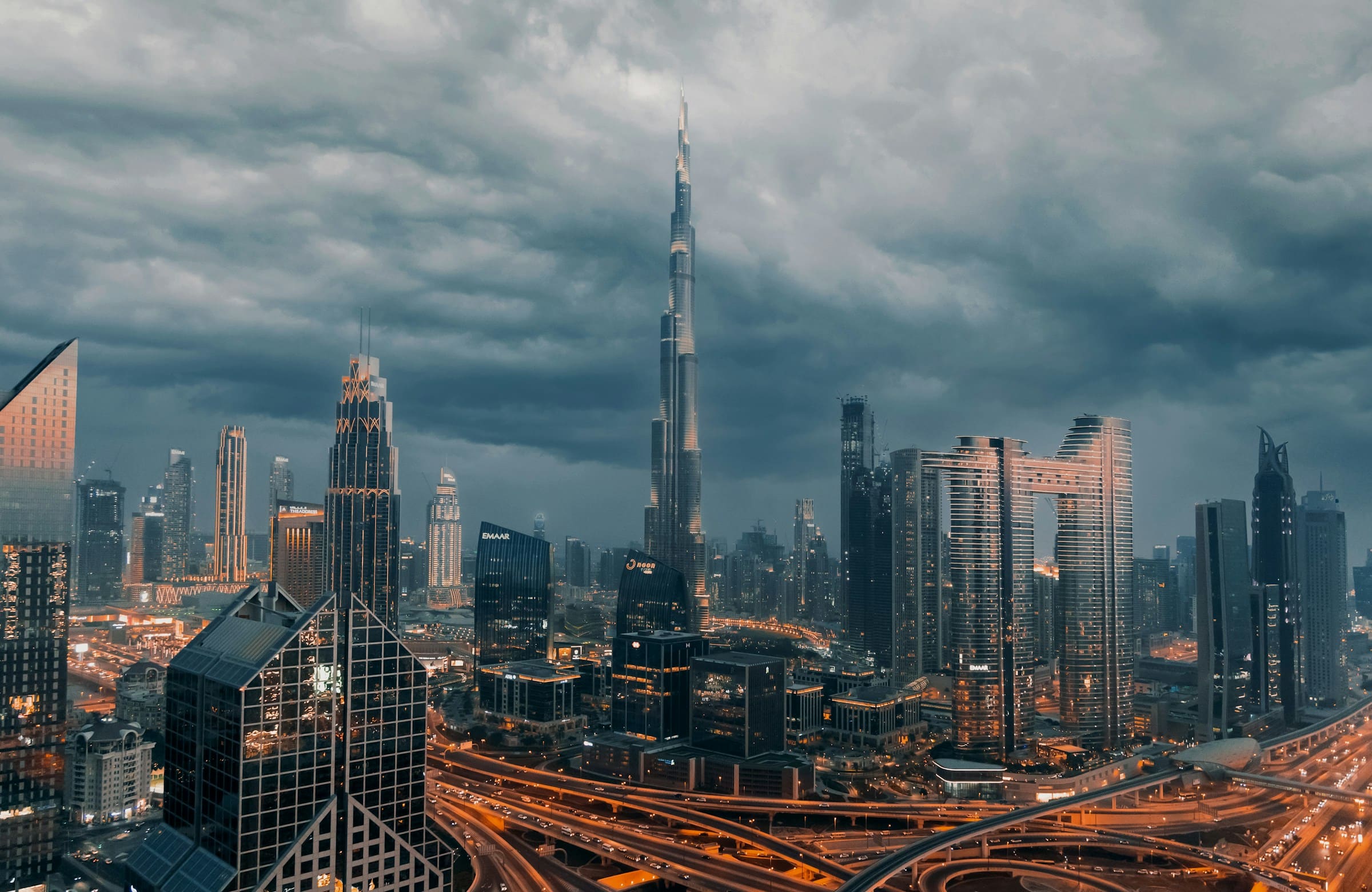 Downtown Dubai under storm clouds, with the Burj Khalifa above the skyline